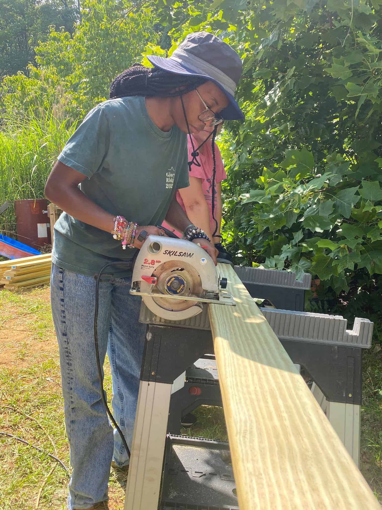 CHC Volunteer using saw